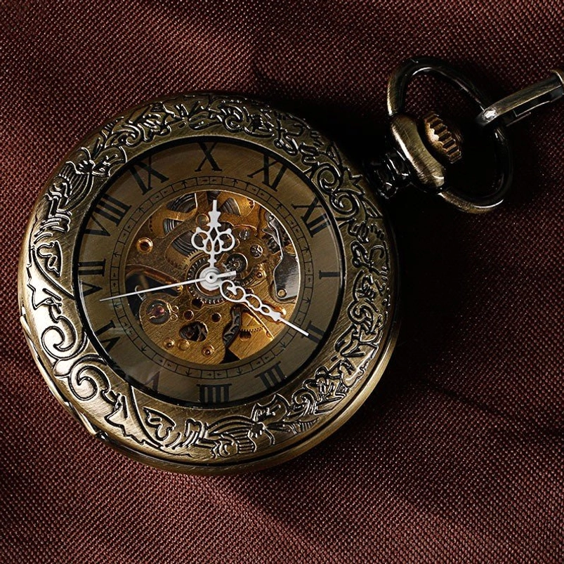 Full skeleton steampunk pocket watch flat lay top-down view, fully carved antique bronze case with Roman numerals