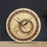 Astronomical steampunk wooden wall clock with dual-tone finish, engraved zodiac dial, brass hardware, and red second hand, displayed at frontal angle on dark paneled wall