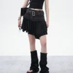 Black asymmetrical pleated denim mini skirt front view - steampunk gothic style with empire waistline and frayed hem