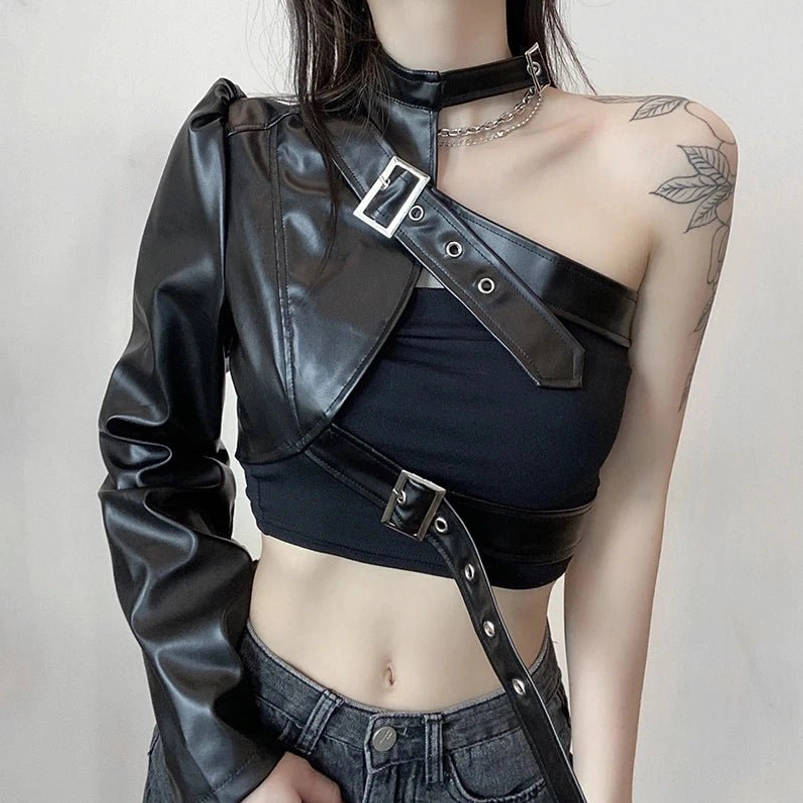 Asymmetrical single-sleeve steampunk cropped leather jacket for women, front-left view showcasing black faux leather construction with metallic buckle straps and industrial hardware details
