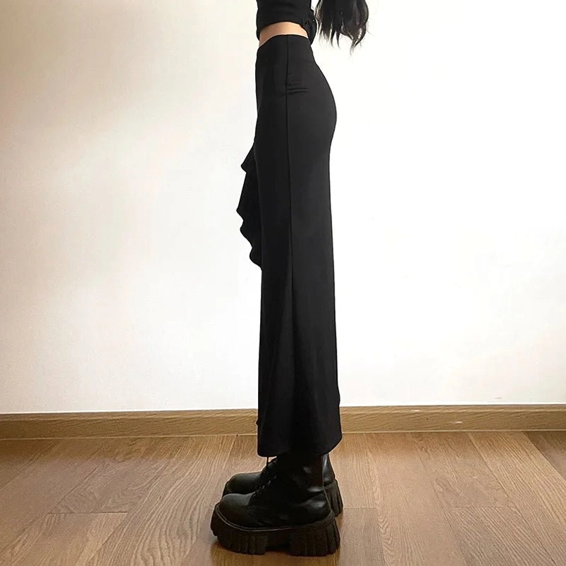 Solid matte black fishtail skirt with slim fit silhouette, right side full-length view showcasing elegant drape