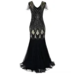Black and gold Art Deco steampunk mermaid evening dress with sheer flutter sleeves and beaded embroidery, front view