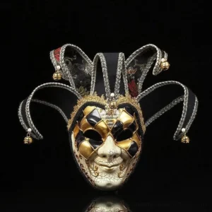 Black and gold Venetian jester steampunk masquerade mask with checkered eye design, bell-adorned jester caps, and cracked facial texture - frontal studio view