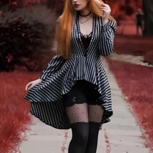 Black and grey striped steampunk jacket with asymmetrical high-low hem and ruffled stand collar, worn by model outdoors in autumn park setting