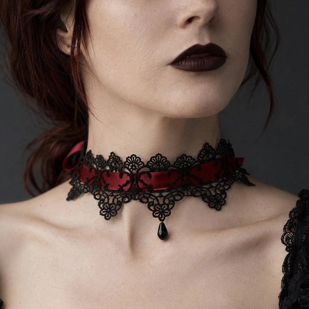 Black lace steampunk choker worn on neck, close-up detail view showing burgundy velvet ribbon and teardrop pendant, gothic-victorian style necklace