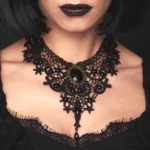 Black lace gothic steampunk choker necklace on model showing front close-up view with dark studio backdrop