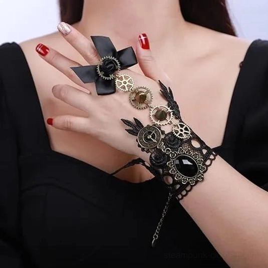Black lace steampunk glove with bronze gears and large black gemstone, worn on female hand in close-up frontal view, featuring elegant satin bow accent