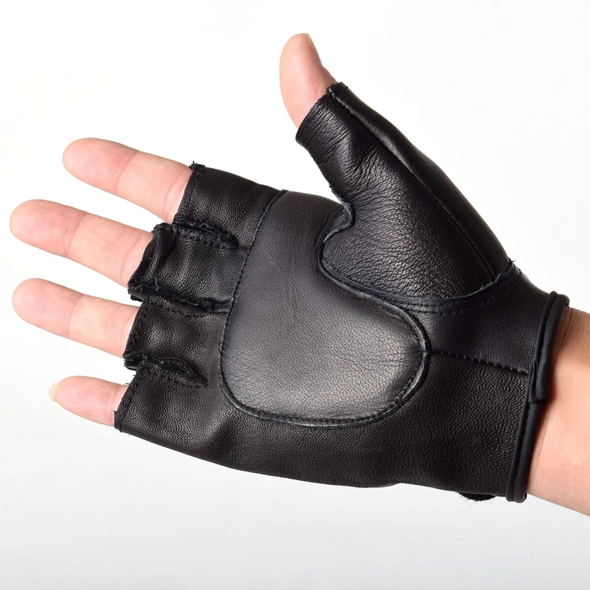 Single black leather fingerless steampunk glove worn on real hand, side profile showing smooth PU leather and neat stitching