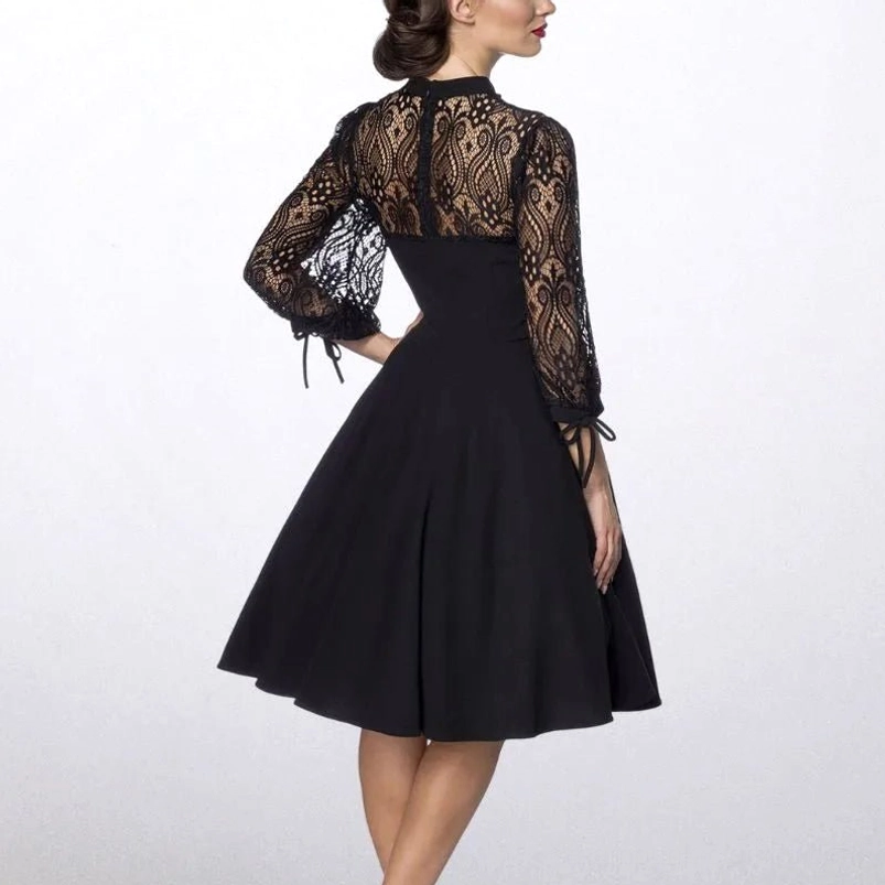 Black steampunk dress back view featuring lace back yoke, fitted waist, flared midi skirt, and back zipper closure