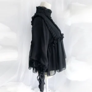 Black lolita steampunk blouse side profile showing semi-sheer chiffon, ruffled decorations and flowy babydoll hem silhouette