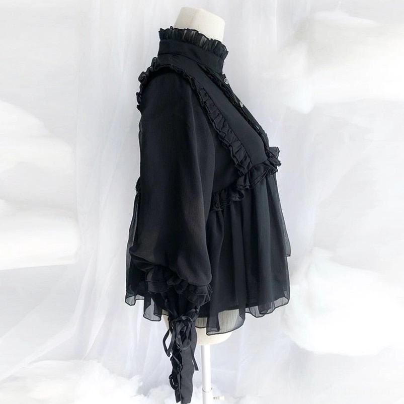 Black lolita steampunk blouse side profile showing semi-sheer chiffon, ruffled decorations and flowy babydoll hem silhouette