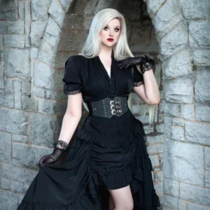 Black steampunk corset waist belt with silver engraved triple buckles and gold studs, worn by model in outdoor stone archway Victorian setting