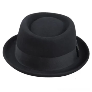 Black steampunk pork-pie fedora showcasing matte wool felt texture and black ribbon band, photographed from right three-quarter angle