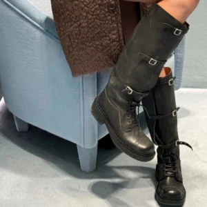 Black steampunk combat boots front low angle showing lace-up design and decorative buckles