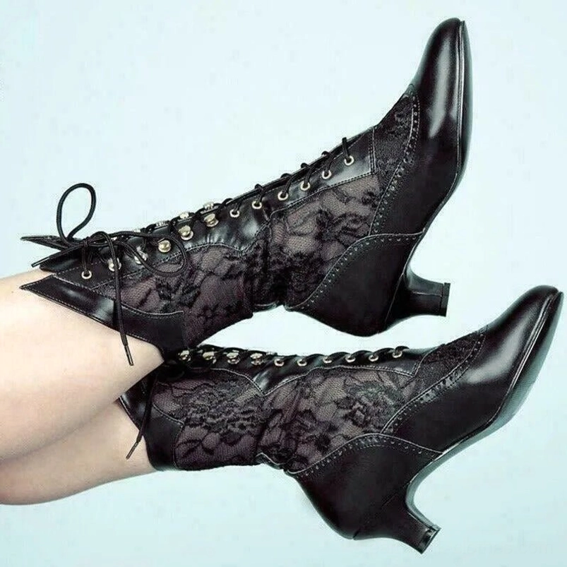 Black Victorian lace-up steampunk boots with floral lace panels and pointed kitten heel, side profile close-up view
