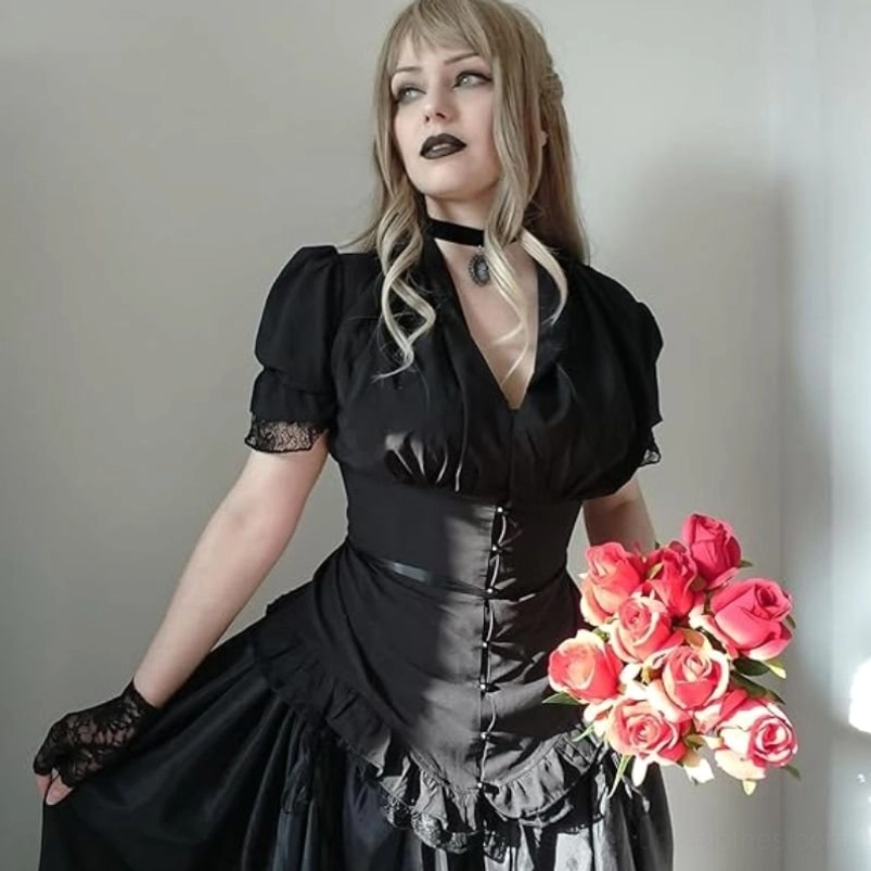 Black vintage steampunk puff sleeve shirt with V-neckline, lace-trimmed cuffs, ruched waist and ruffled hem, shown on model three-quarter side view