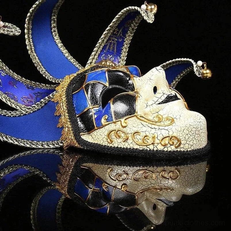 Blue-black and gold Venetian jester side profile steampunk mask showing 3/4 angle with cracked off-white face, scroll gold carvings, and bell-topped jester fins
