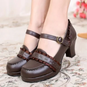 Brown steampunk Mary Jane block heel shoes for women, frontal view showing faux leather material, decorative ruffle vamp trim, antique buckle ankle strap, and sturdy block heel