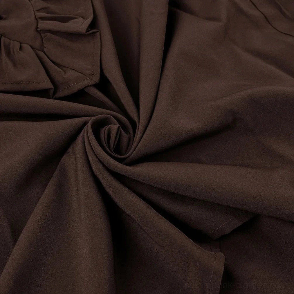Close-up detail of brown steampunk shirt fabric showing matte woven cotton blend material with soft draping
