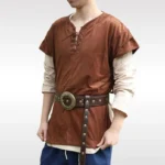 Brown faux suede steampunk tunic vest with metal eyelet lace-up neckline, front three-quarter view on male model wearing layered linen undershirt