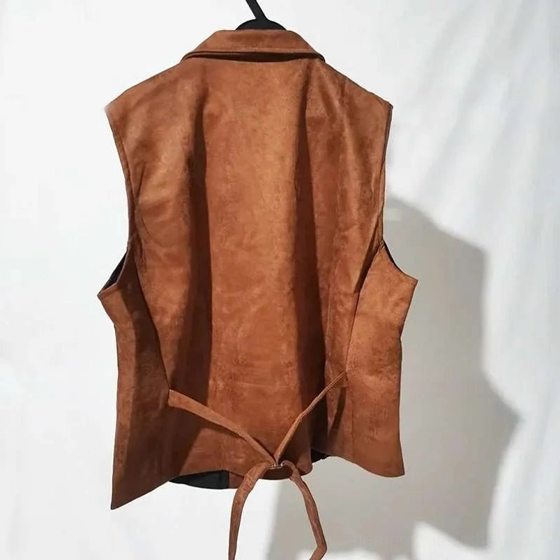 Brown suede steampunk vest back view showcasing adjustable tie strap and matte fabric texture on white studio background