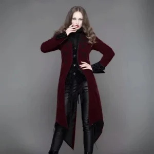 Burgundy gothic velvet tailcoat steampunk coat worn by model - three-quarter front view showing ornate black scroll embroidery and asymmetrical split hem design
