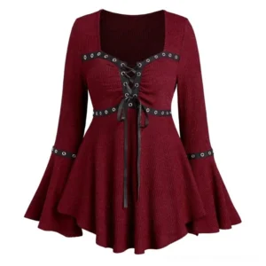 Burgundy gothic steampunk lace-up knit top flat lay front view, featuring black satin ribbons, metal eyelet grommets, ruched bust design, and flared bell sleeves on white studio background