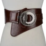 Coffee brown split leather steampunk wide waist corset belt with vintage round metal buckle, worn on dress form mannequin, front view showcasing premium leather finish and textured hardware