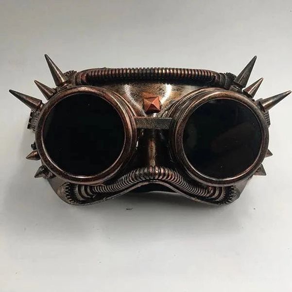 Copper steampunk welder goggles mask with spike detailing and dark tinted lenses, front view on white background