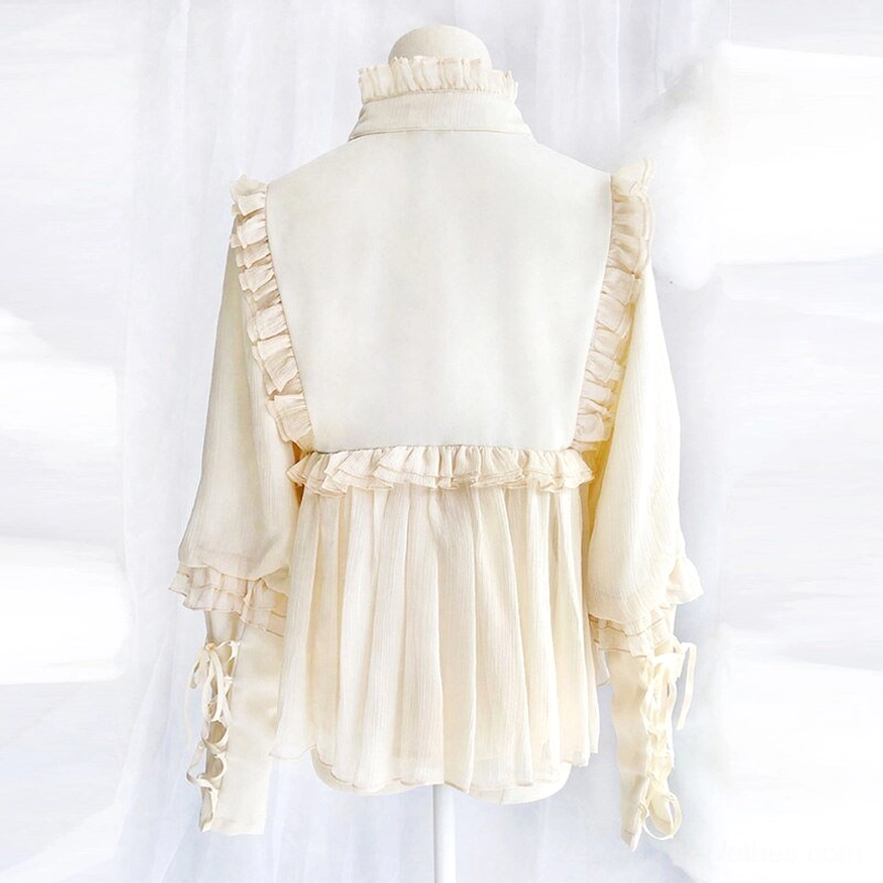 Cream white steampunk blouse back view with ruffled back trim, pleated chiffon hem and decorative lace-up cuffs