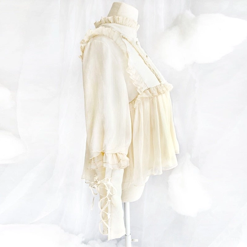 Cream white lolita steampunk blouse side view showing lace-up long sleeves, pleated chiffon hem and ruffled details