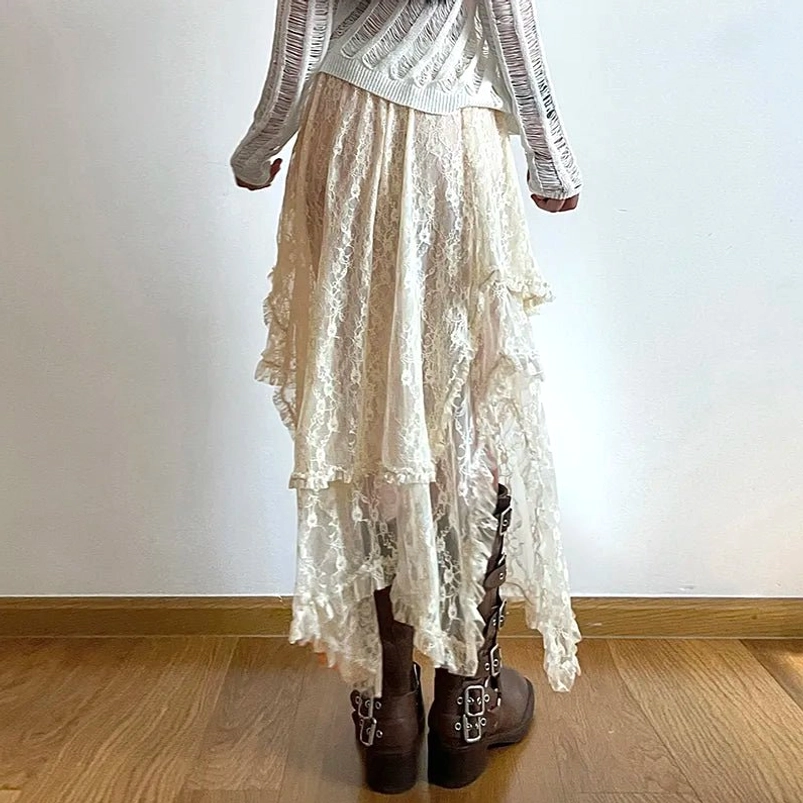 Back view of cream lace asymmetric steampunk skirt showing layered ruffled hem and lace detail, styled with brown buckle boots