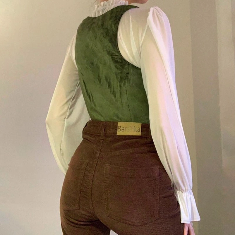 Dark green velvet steampunk corset vest back view, showcasing rear corset structure and tailoring, worn with brown corduroy pants