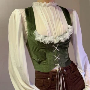 Dark green velvet steampunk corset vest with white lace ruffle trim and front lace-up design, front three-quarter view
