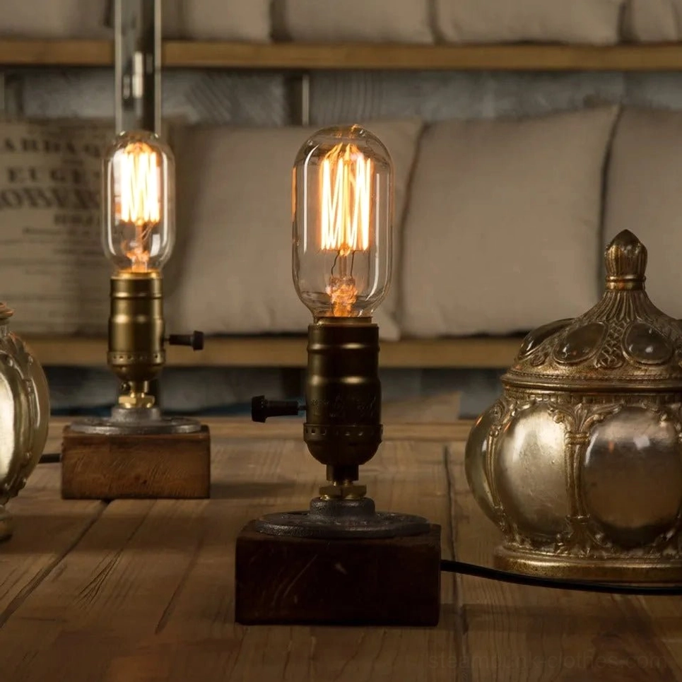 Dual tubular Edison bulb steampunk lamp with exposed spiral filaments, vintage socket switch, and aged bronze industrial fixtures