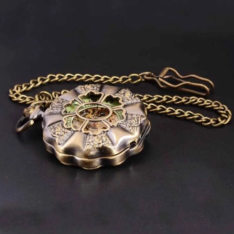 Vintage bronze steampunk pocket watch oblique view with linked chain and clasp, floral embossed scalloped case detail