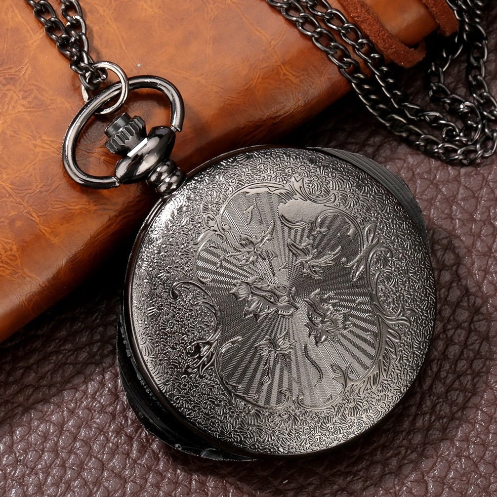 Eye-shaped steampunk closed pocket watch overhead view with full embossed carved cover and gunblack stainless steel finish