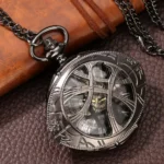 Eye-shaped steampunk hollow pocket watch front view with gunblack metal case and Roman numeral dial on vintage leather desktop