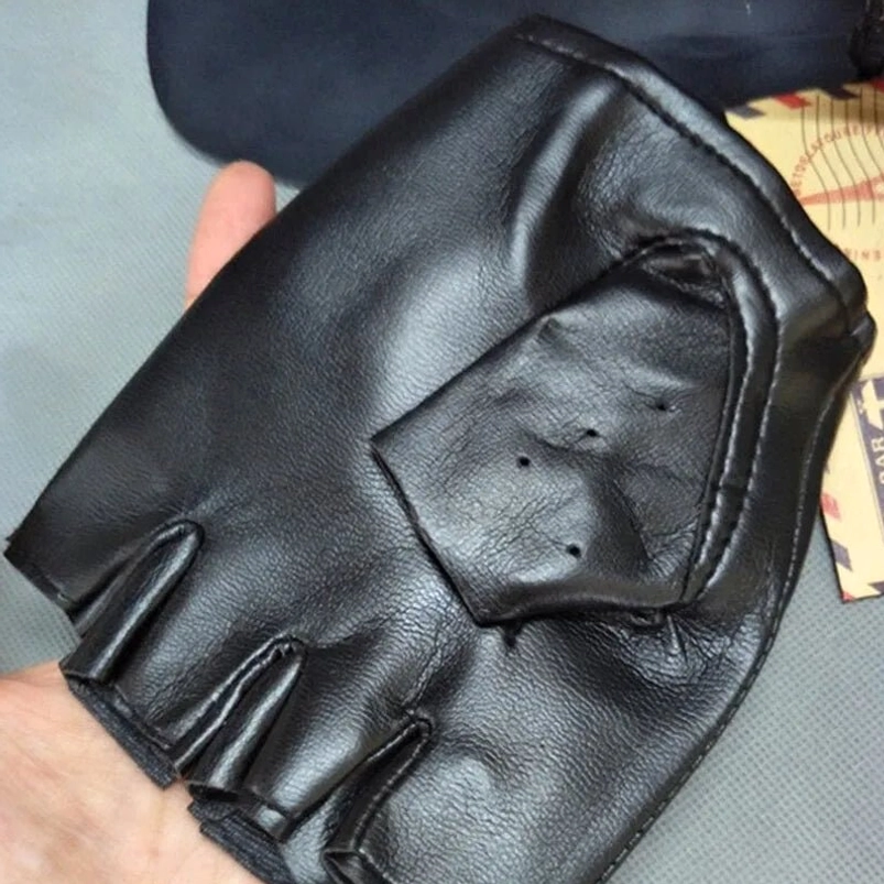 Single black fingerless biker glove with padded back panel and ruffled finger openings on hand