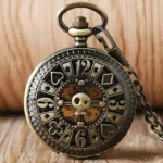 Gambler steampunk pocket watch front view with bronze finish, poker-themed numerals, and skeleton dial center on wooden desktop