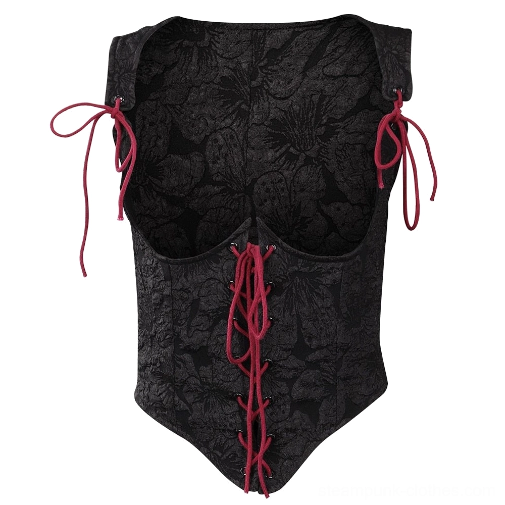 Close-up detail of gothic steampunk corset bodice showing embossed floral jacquard texture, red front lacing system with metal eyelets, and red adjustable shoulder tie straps