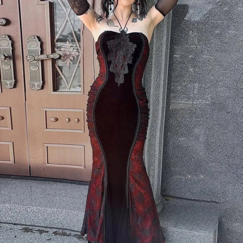 Gothic Victorian strapless mermaid dress back three-quarter angle, backless cut with lace chest decoration, fishtail silhouette, worn at vintage wooden door entrance
