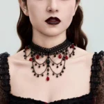 Gothic lace choker necklace worn on model, front view showcasing black lace with red crystal teardrop beads and cascading layered chains