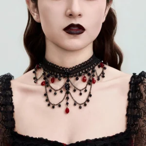 Gothic lace choker necklace worn on model, front view showcasing black lace with red crystal teardrop beads and cascading layered chains