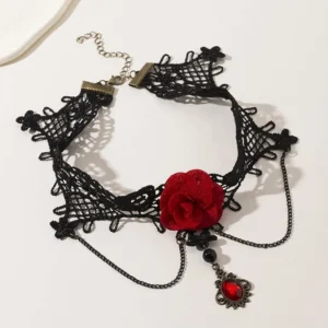 Black crochet lace choker necklace flat lay, adjustable chain, red fabric rose and gem drop pendant on white background