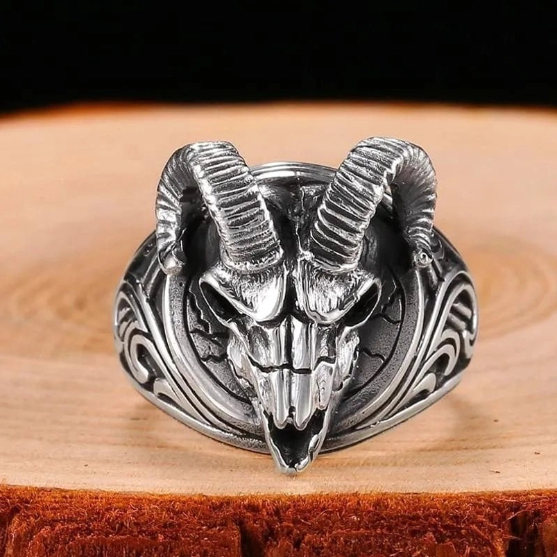 Gothic ram skull ring frontal view displaying detailed skull carving and ornate scroll patterns on ring shoulders