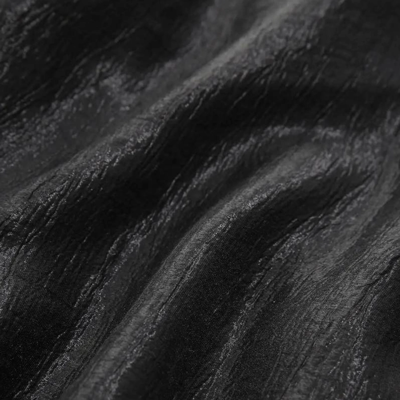 Black steampunk gothic dress fabric close-up showing wrinkle-resistant satin-like material with subtle sheen and premium texture