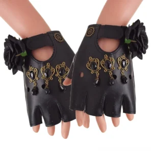 Gothic fingerless gloves worn on mannequin hands, featuring black leather with fabric roses and gem-inlaid metal pendants, front three-quarter view