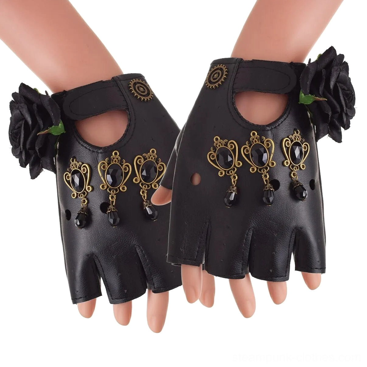 Gothic fingerless gloves worn on mannequin hands, featuring black leather with fabric roses and gem-inlaid metal pendants, front three-quarter view