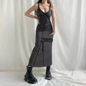 Gothic steampunk slip maxi dress side profile showing front lace-up bodice, eyelet neckline trim, and floor-length silhouette with split hem on model in platform boots